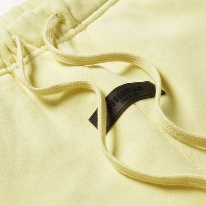 FEAR OF GOD ESSENTIALS CANARY SHORTS (FW22) - Hype Locker UK