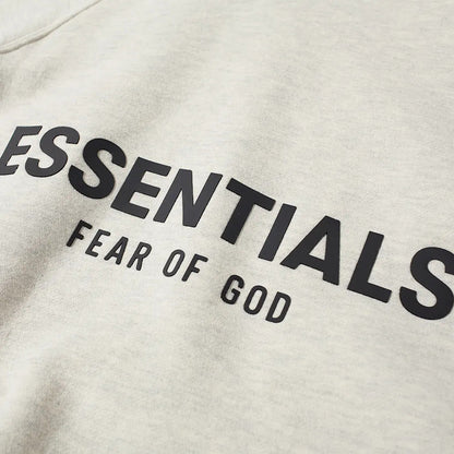 FEAR OF GOD ESSENTIALS LIGHT HEATHER OATMEAL BACK LOGO HOODIE (SS21) - Hype Locker UK