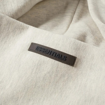 FEAR OF GOD ESSENTIALS LIGHT HEATHER OATMEAL BACK LOGO HOODIE (SS21) - Hype Locker UK